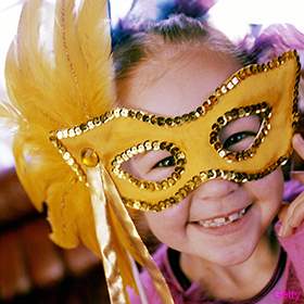 little-girl-wearing-mardi-gras-mask-280x2801